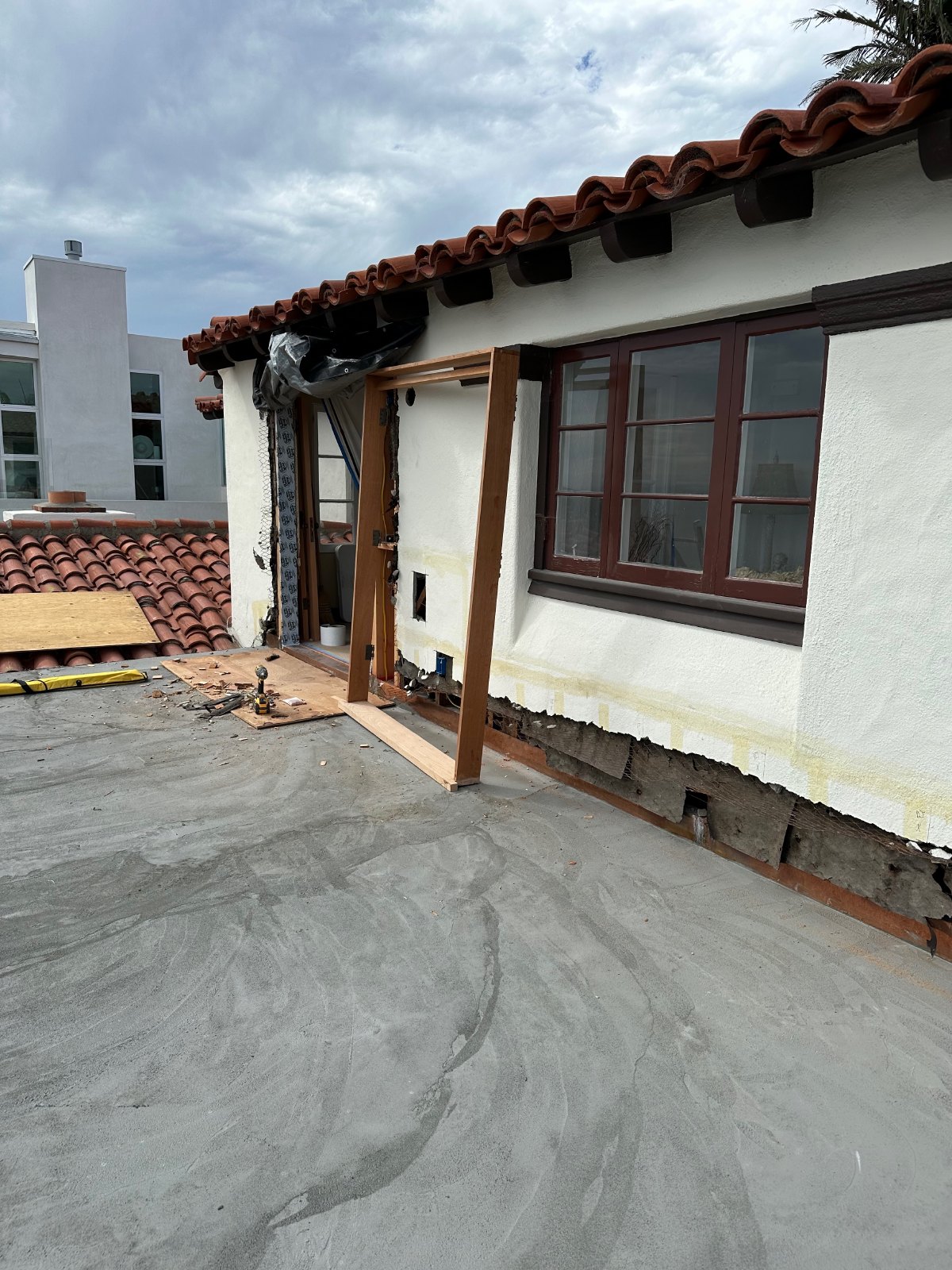 Custom double-door frame dry-fit into historic wall opening