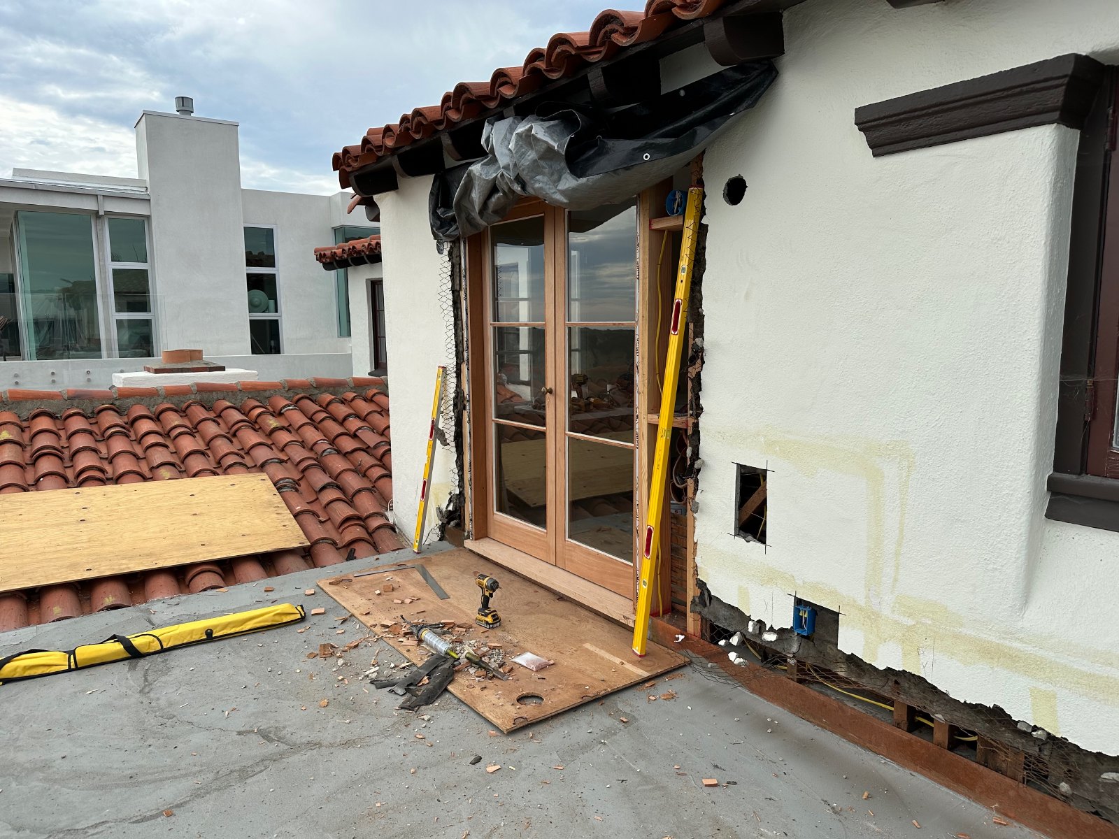 Custom double doors installed in prepared wall opening