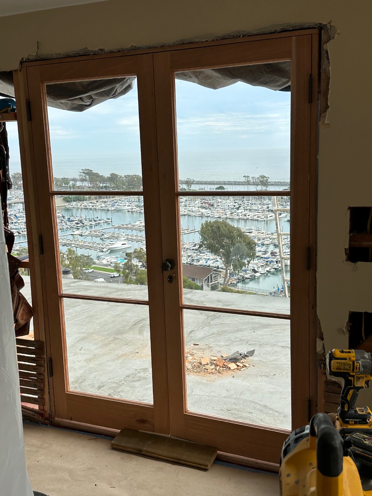 View through custom double doors toward Dana Point Harbor