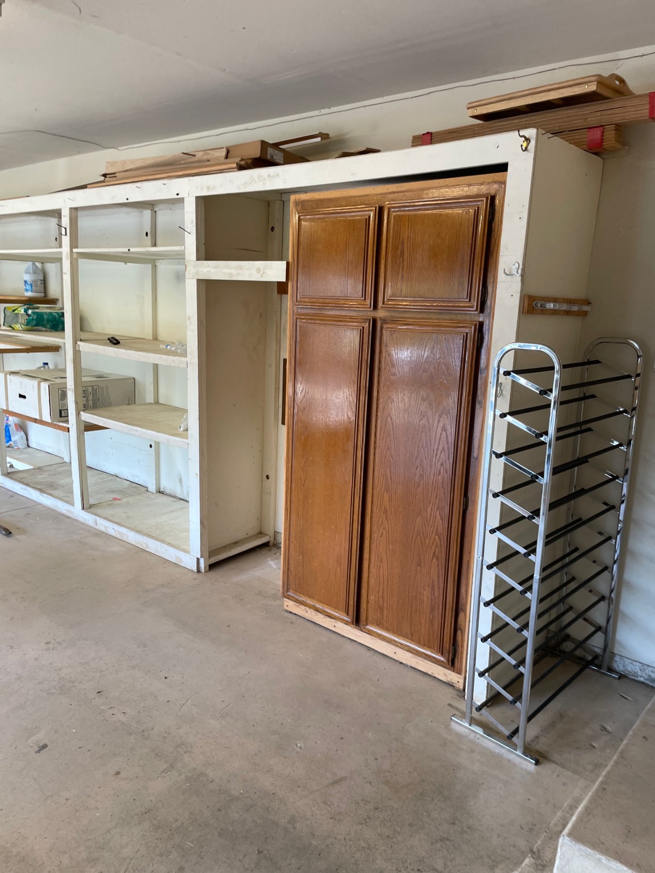 Original garage cabinet wall before renovation