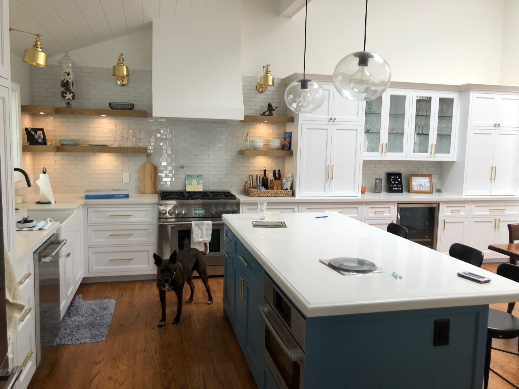 Completed custom kitchen remodel with vaulted ceiling and blue island