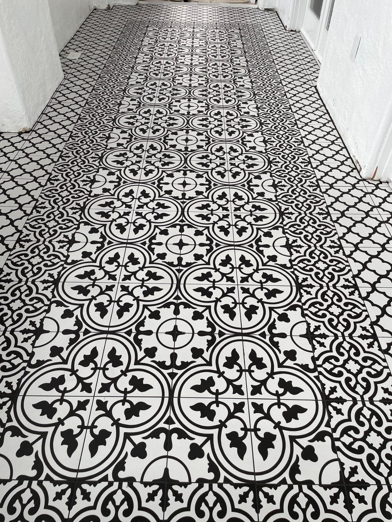 Wide finished view of custom sunroom tile floor