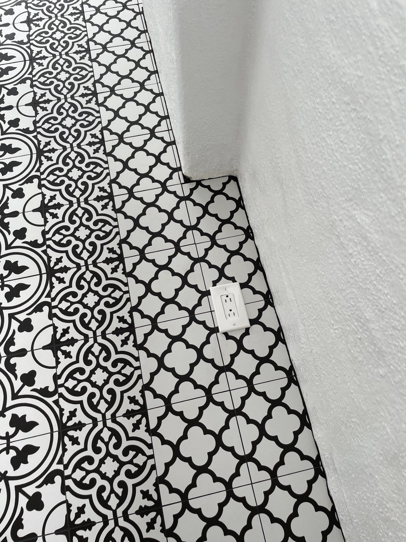 Detailed tile cut around floor outlet